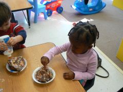 Toddlers making mud pies at Children's Palace