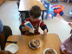 Toddlers making mud pies at Children's Palace
